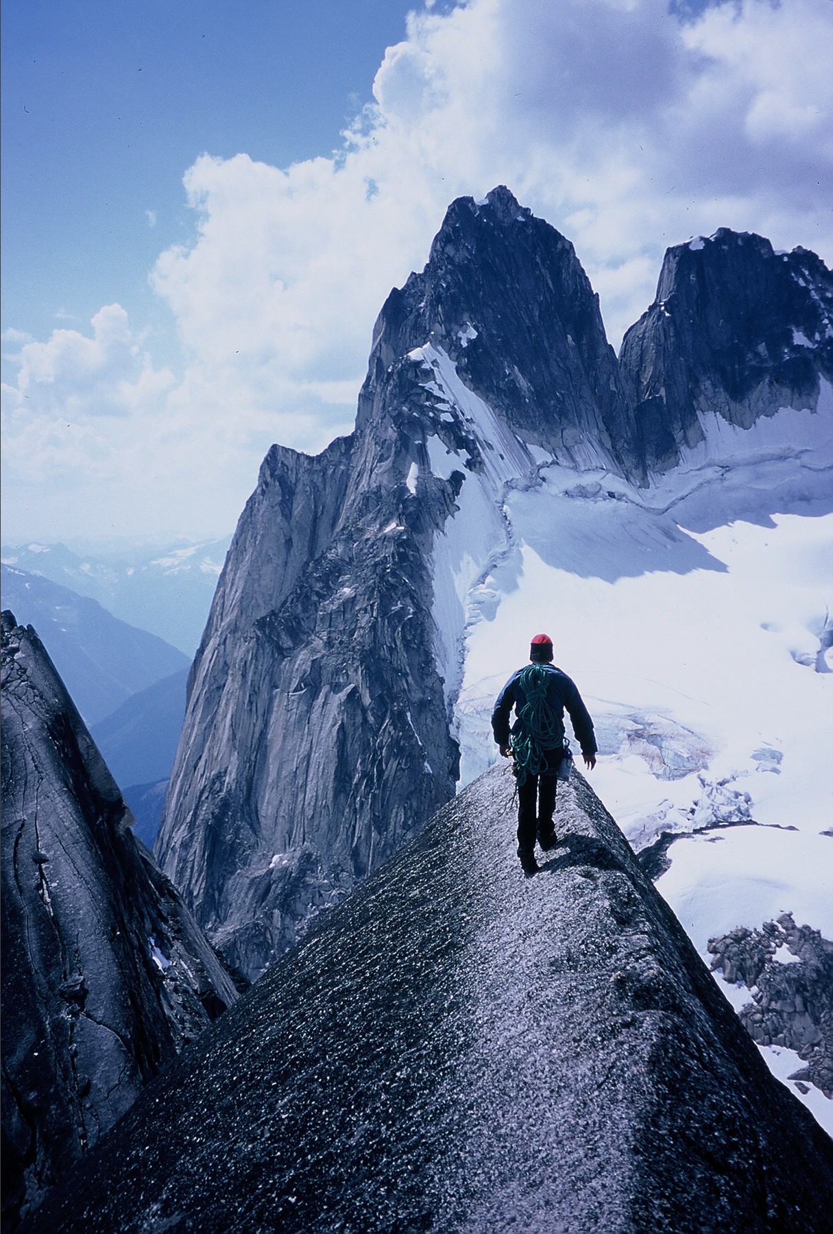 man climbing mountain