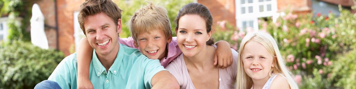 Family in front of house